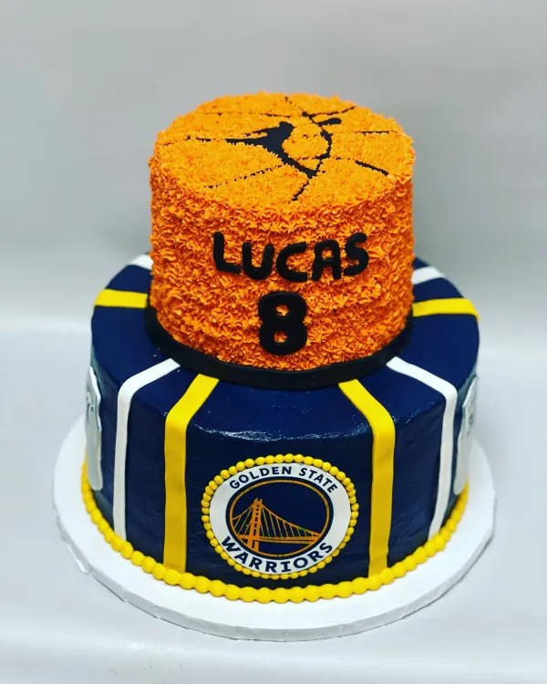 Two-tier Golden State Warriors cake with a piped orange basketball tier reading Lucas 8