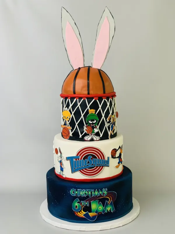 Three-tier Space Jam cake with a basketball, bunny ears, Tune Squad logo and Christian's 6th Jam