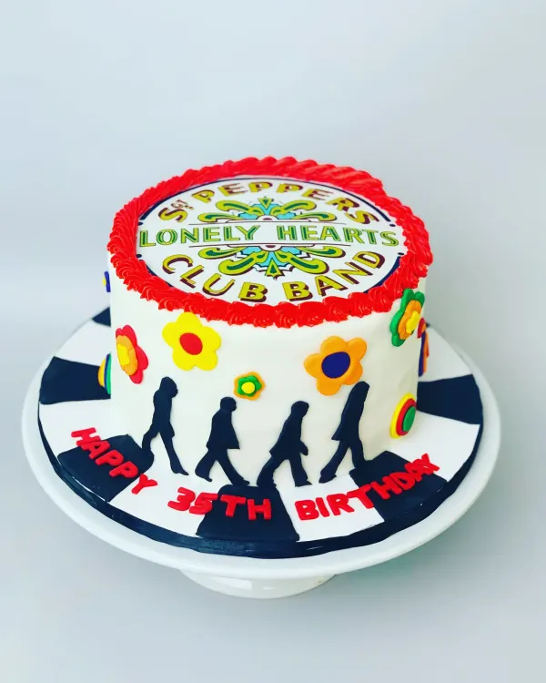 Beatles birthday cake with a Sgt. Pepper drum topper, Abbey Road silhouettes and Happy 35th Birthday