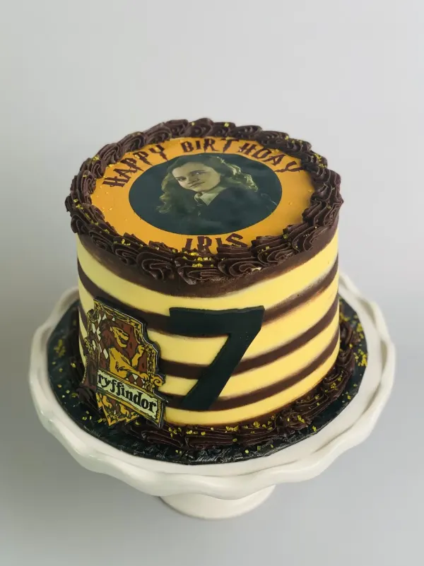 Harry Potter birthday cake with a Hermione image, Gryffindor crest, number 7 and Happy Birthday Iris