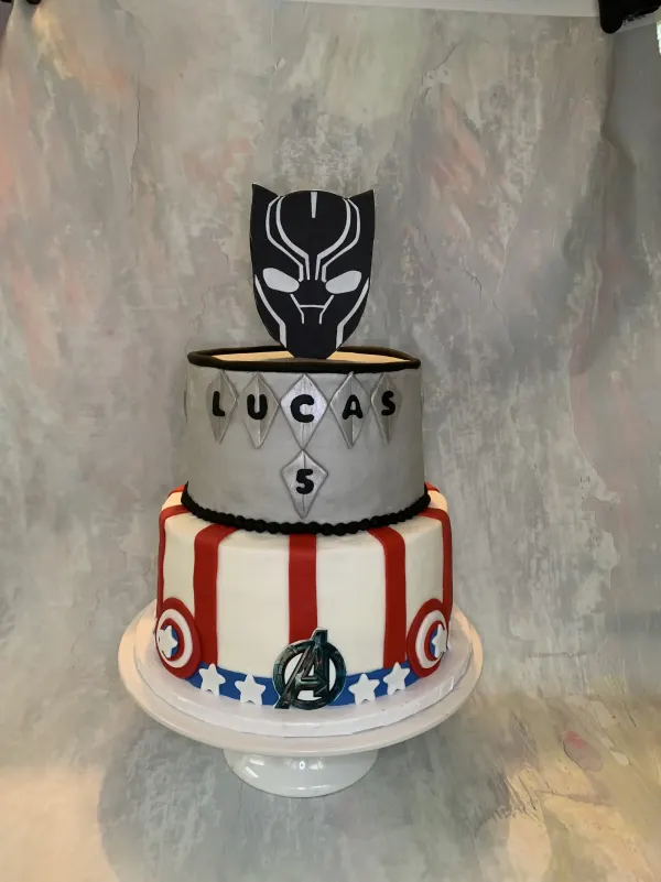 Two-tier Marvel birthday cake with a Black Panther mask topper and Captain America stripes, Lucas 5
