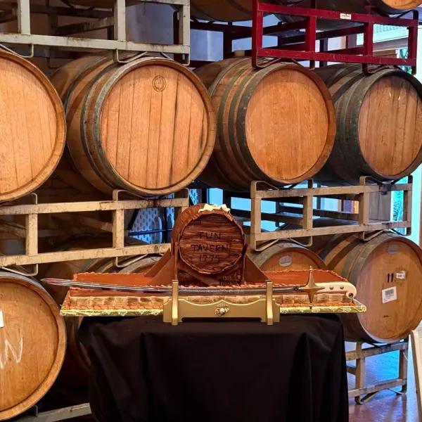 Sculpted Golden Gate Bridge cake on a table in a barrel room
