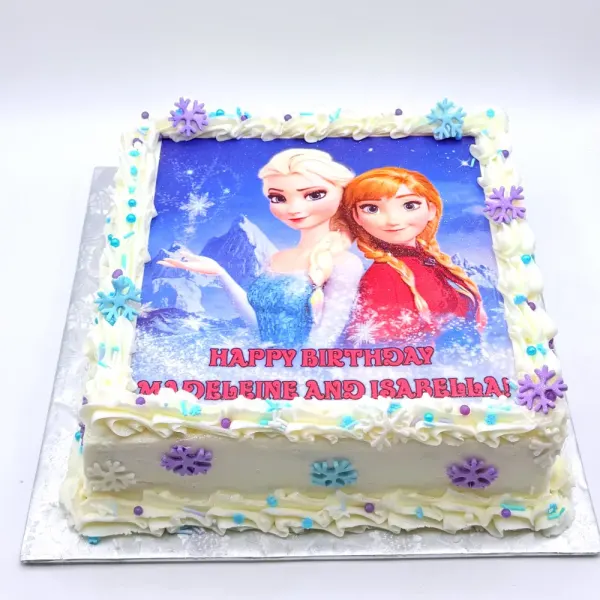 Sheet cake with an edible Frozen print, white piped borders and purple and blue snowflakes
