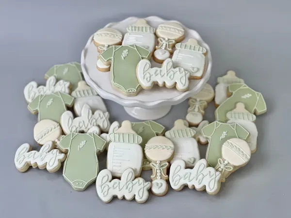 Sage green and white cookie set of onesies, bottles, rattles and cookies lettered baby