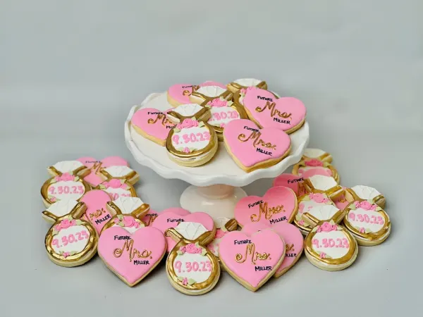 Pink Future Mrs. Miller heart cookies with gold diamond ring cookies dated 9.30.23