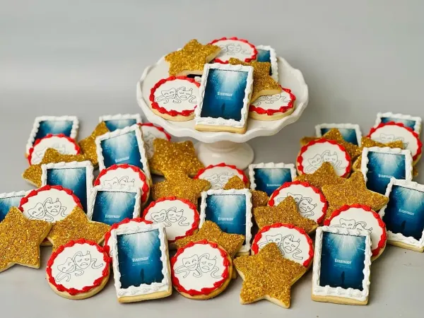 Theater cookies with gold glitter stars, comedy and tragedy masks and Everybody playbill prints
