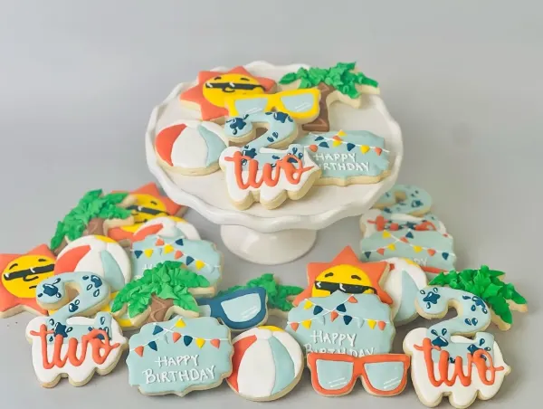 Beach party cookies with sun, palm tree, beach ball, sunglasses and a number 2
