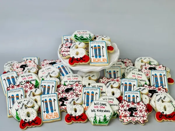 Ski birthday cookies lettered We Came We Saw We Kirkwood, Skiing Into 6 and Happy Birthday Lachlan