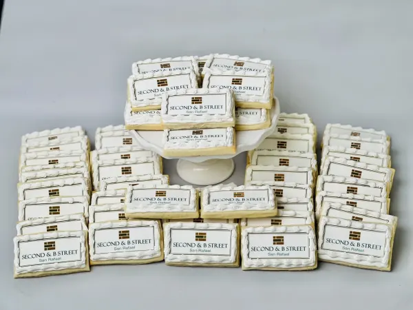 Rectangular logo cookies iced in white reading Second and B Street San Rafael
