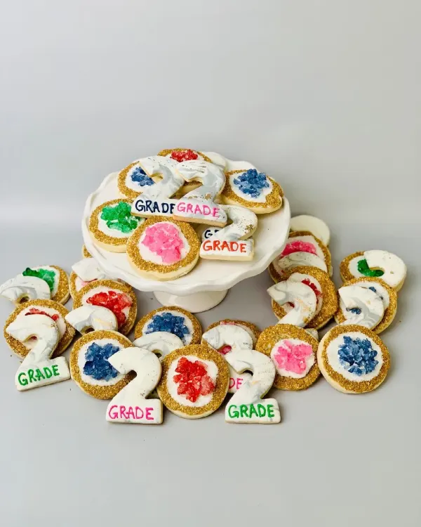 Geode cookies with rock candy centers and gold sanding sugar, plus marbled number 2 plaques
