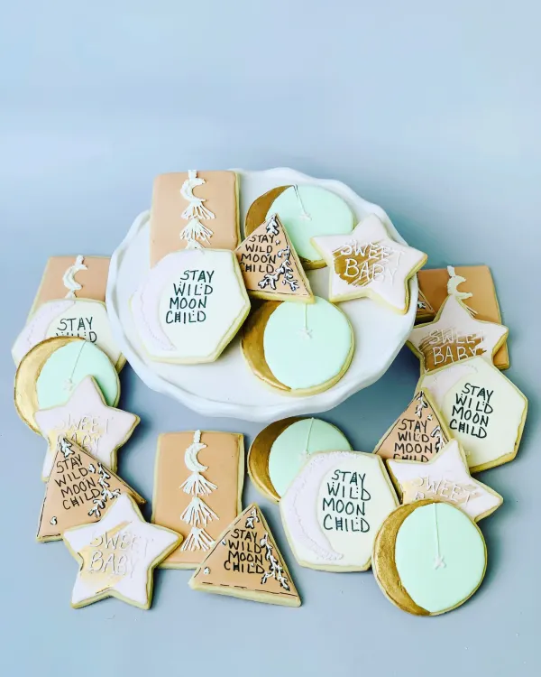 Boho cookie set reading Stay Wild Moon Child and Sweet Baby with gold moons, stars and macrame