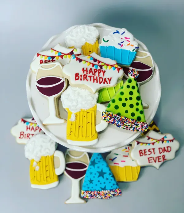 Birthday cookie set with beer mugs, wine glasses, party hats and HAPPY BIRTHDAY plaques