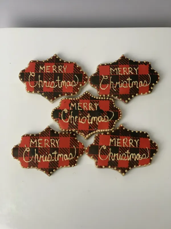 Buffalo plaid plaque cookies hand-lettered MERRY CHRISTMAS in gold with gold bead borders