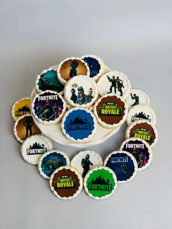 Round cookies topped with printed Fortnite and Battle Royale logos and character images