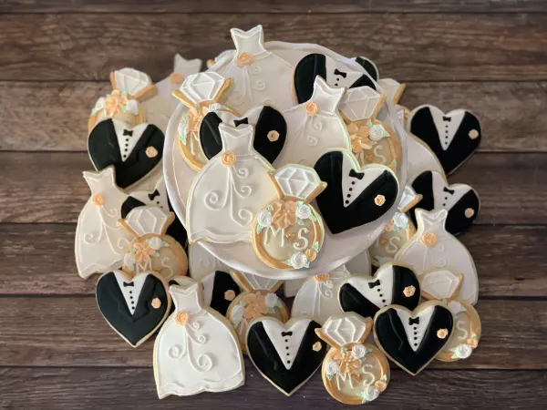 Wedding cookie set of white gowns, black tuxedo hearts and gold rings monogrammed M and S