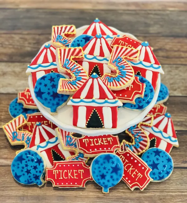 Circus cookies with red and white big top tents, TICKET signs, star balloons and a number 5