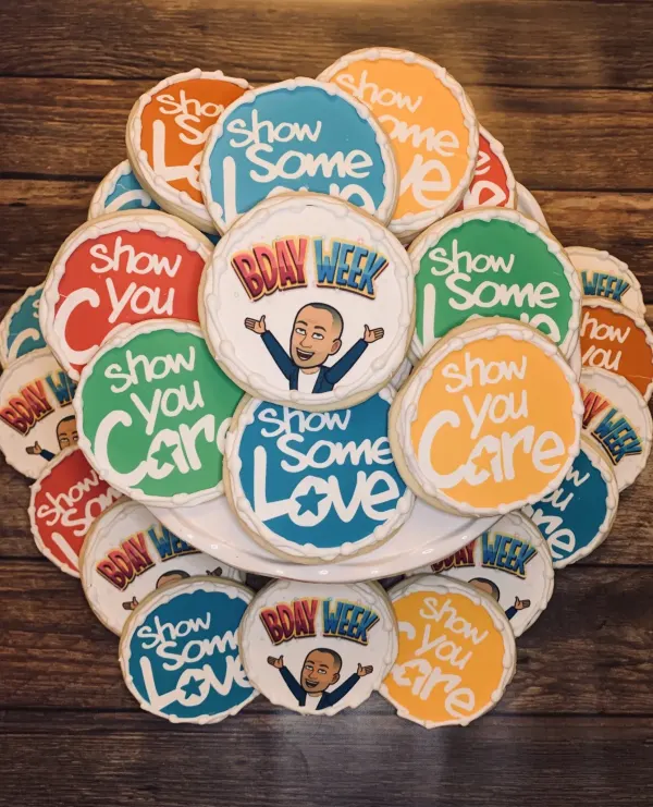 Round cookies printed Show Some Love, Show You Care and BDAY WEEK with a cartoon avatar