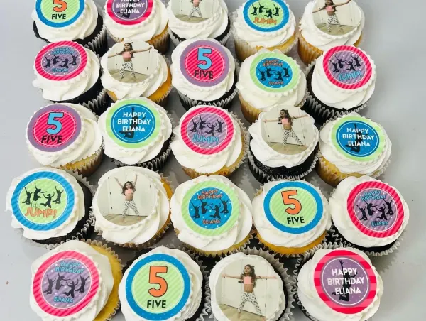 Cupcakes with toppers reading Happy Birthday Eliana, 5 FIVE and Let's JUMP plus photos of a girl jumping