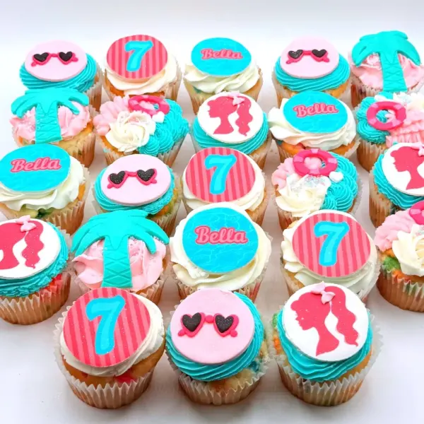 Malibu Barbie cupcakes in pink and turquoise with palm trees, sunglasses and a number seven for Bella