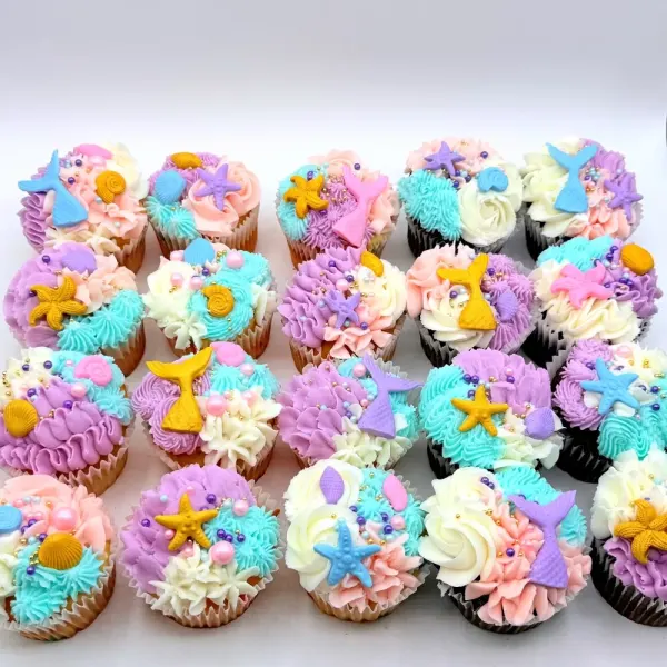 Mermaid cupcakes in pastel purple, pink and aqua with fondant starfish and shells