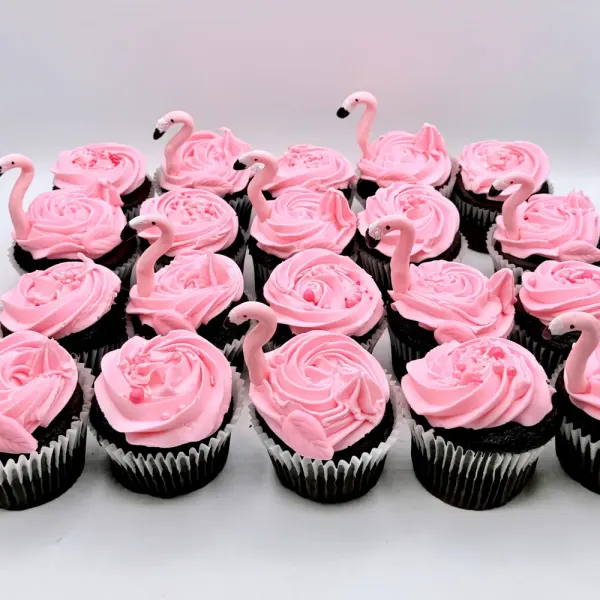 Pink rosette cupcakes with fondant flamingo toppers